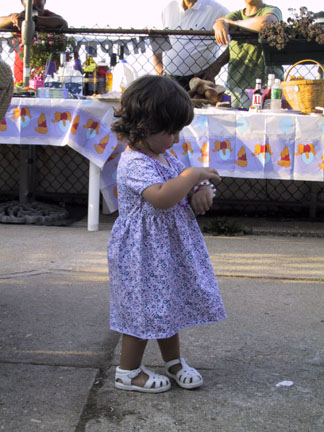 Maddie tries on her new bracelet.