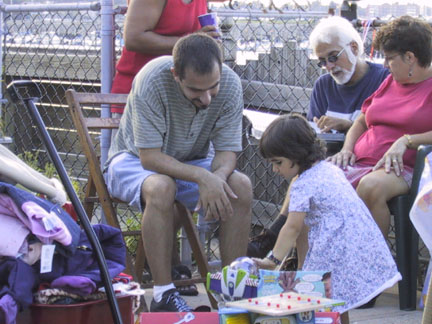 Nick tries to convince Maddie to let him play with some of the toys.