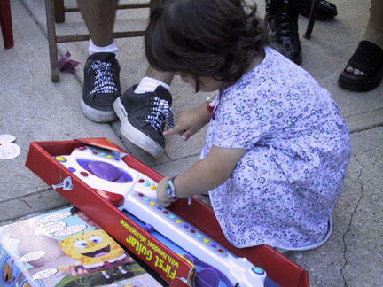 Maddie checks out her first guitar.